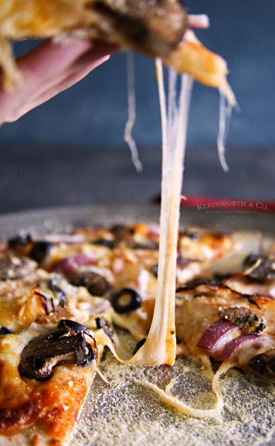 How to make Homemade Pizza Crust: This Onion and Mushroom Thin Crust Pizza is simple and easy to make. The perfect homemade pizza for the whole family.