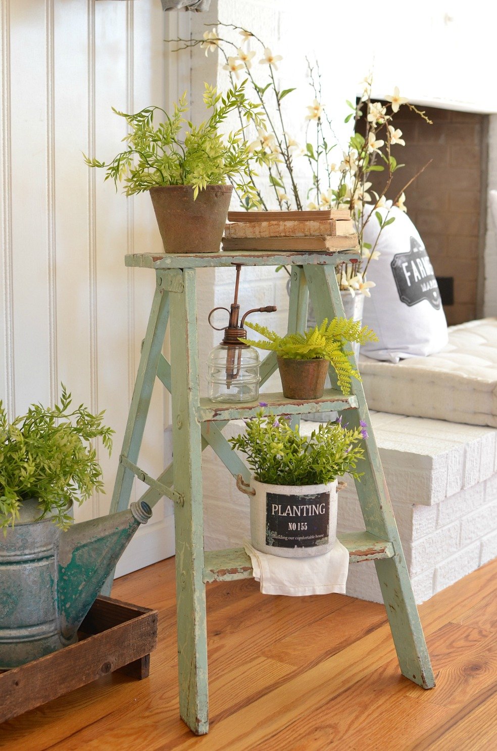 A Simple Vintage Spring Entryway. See how this farmhouse entryway is styled with a vintage ladder and touches of spring decor!